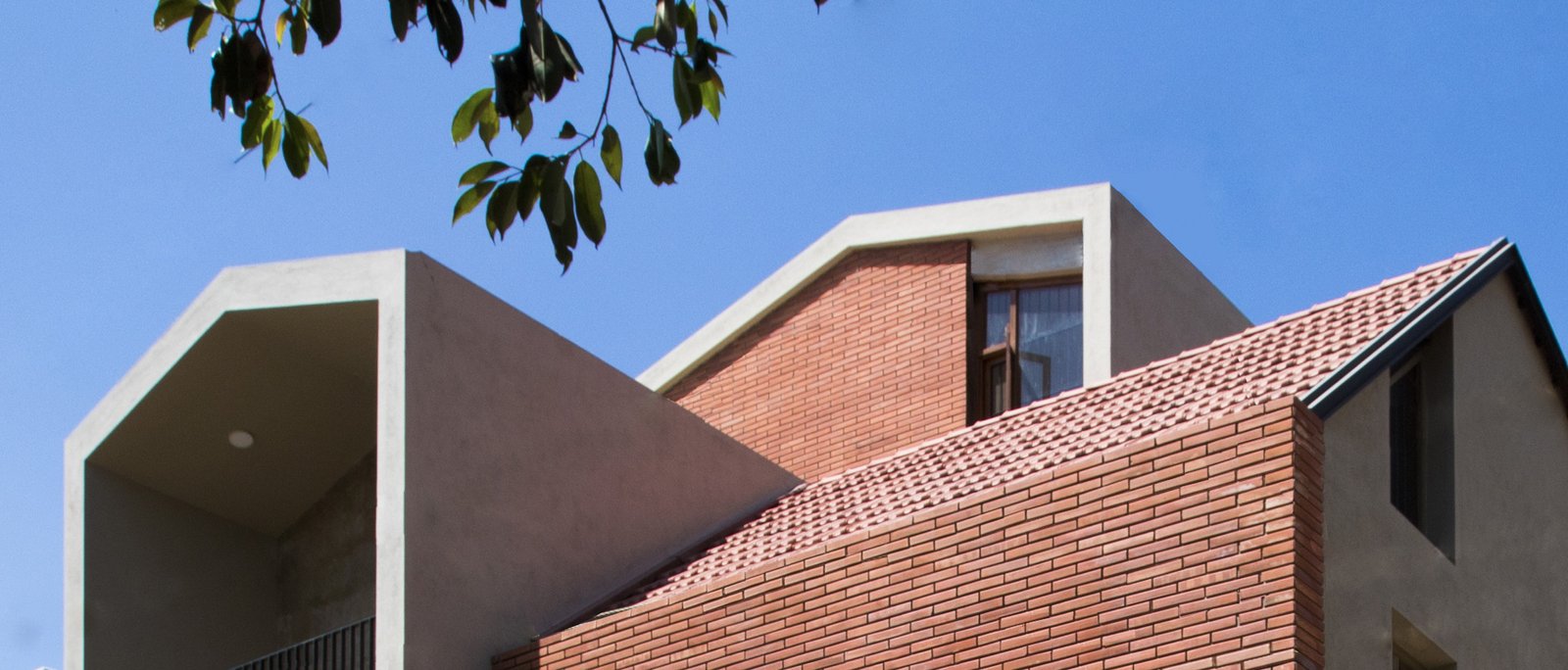 pitched house design by Kamat & Rozario