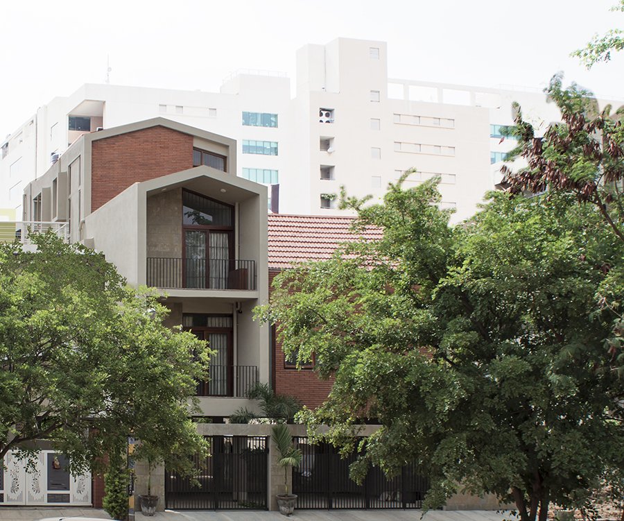 Frontal foliage view - pitched house design